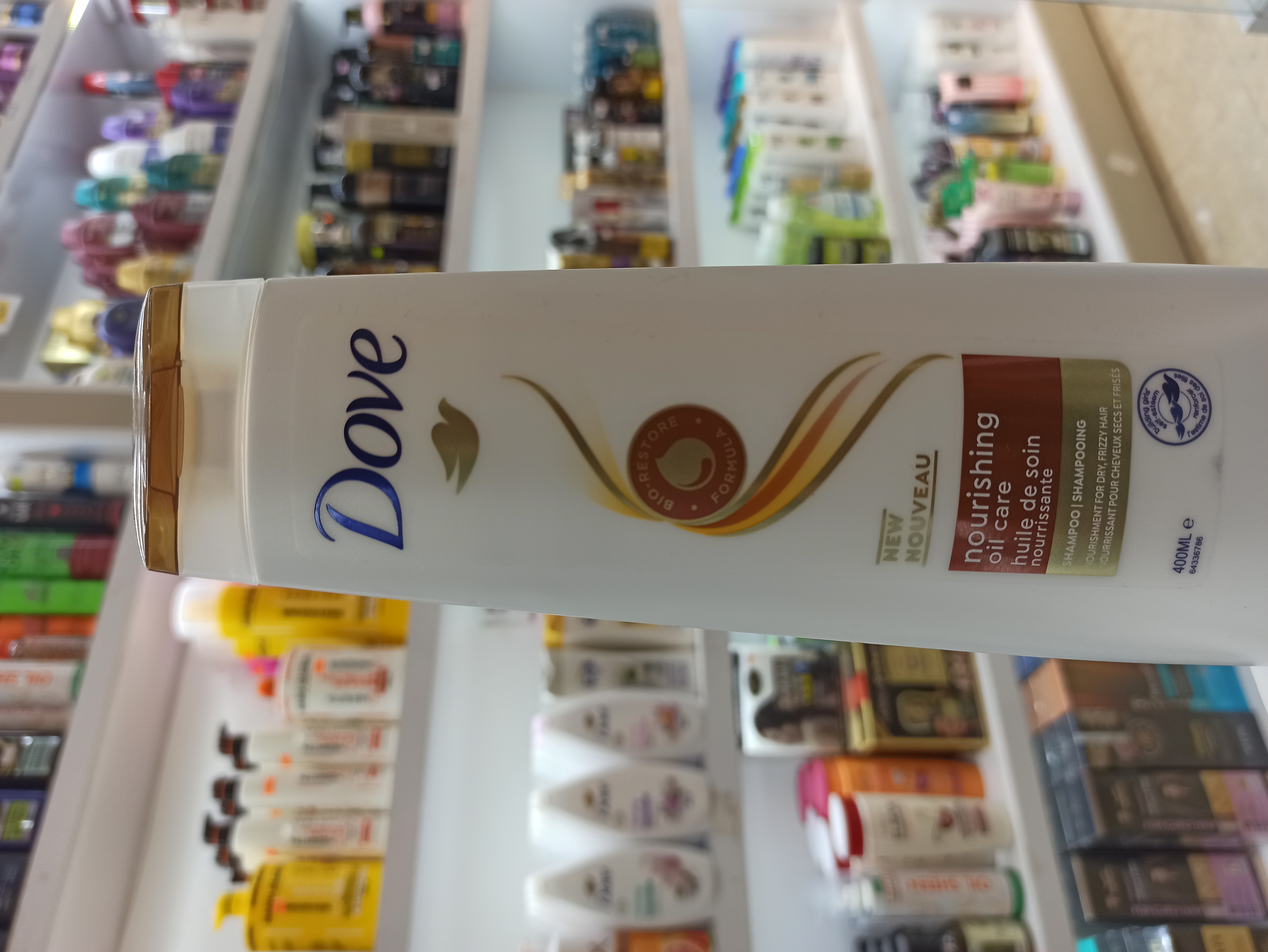 شامپو داو مدل Nourishing Oil Care مراقبت مغذی با روغن مناسب موهای خشک و وز حجم ۴۰۰ میل