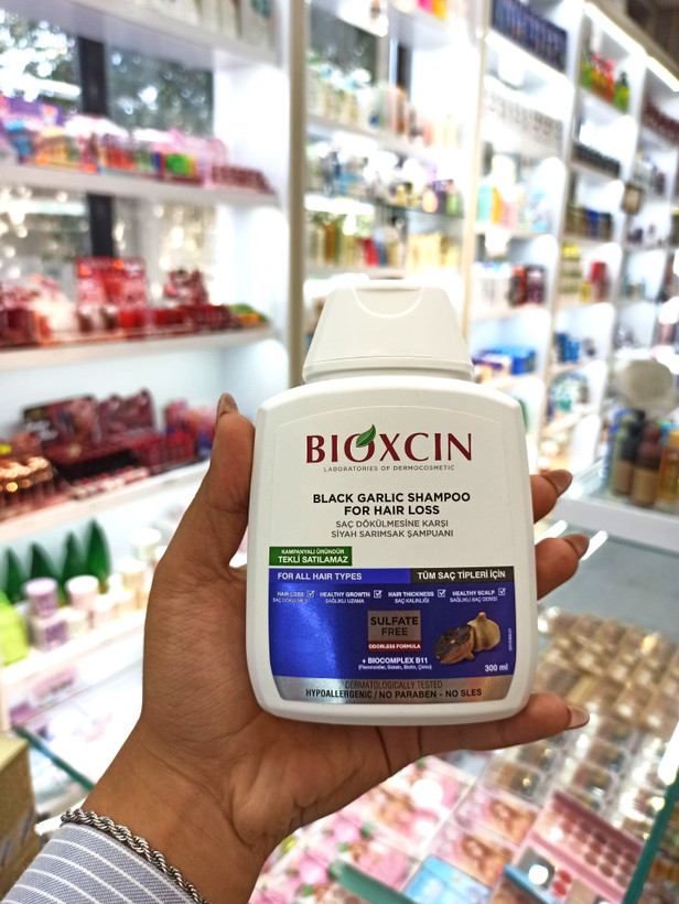 شامپو ضد ریزش مو مدل سیر سیاه BIOXCIN حجم 300 میلی لیتر